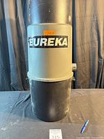 Front view of Eureka central vacuum canister showing logo