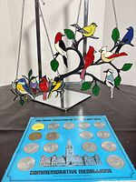 Overall lot showing suncatcher hanging and medallion board beneath