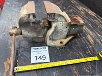 Full view of Maple Leaf bench vise with measuring tape