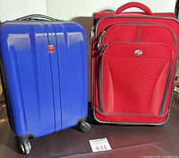 Front view of both suitcases showing overall design and colors