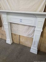 Front view of white MDF mantel surround