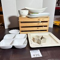 Group view of all seven ceramic serving pieces arranged on display