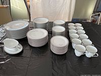 Full view of stacked dinnerware set on table