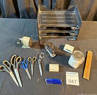 overall view showing letter trays, scissors, stapler, pens, jar, folding ruler