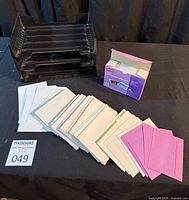 overview showing trays, box and assorted envelopes