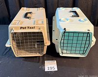 Two pet carriers side by side showing overall design, colors and condition