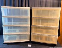 Front view of both 4-drawer towers showing translucency and caster bases