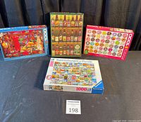 Group shot of four boxed 1000-piece puzzles on table