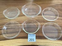 All six glass pieces arranged on wood surface