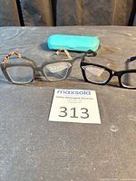 Overall view two pairs glasses and case