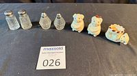 Full lot with four glass shakers and three ceramic dog pieces