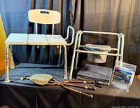 All four items grouped: transfer bench, commode, cushion, folding cane seat