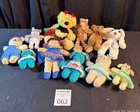 All nine stuffed toys arranged on black surface