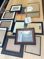 Overhead view showing majority of the assorted frames laid out on table