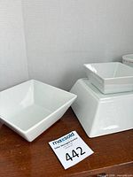 Group of square porcelain bowls showing sizes