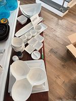 overview of all white porcelain dishes on table