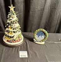 Tree and ceramic light together on table