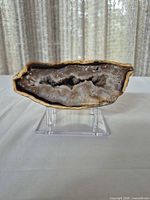 Front view of agate slice on stand showing crystal interior