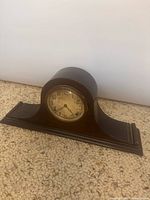 Full view of tambour mantel clock front and wood case