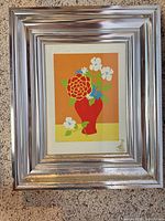Full view of framed floral print showing image, mat, and silver frame
