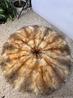 Top view of round fur rug displaying color and pattern