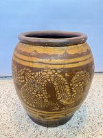 Full view of ceramic jardiniere showing dragon motif and coloration