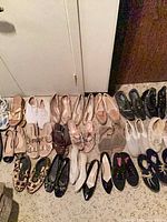 All sixteen pairs arranged in two rows on floor