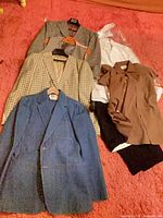 Full lot layout on floor showing all garments