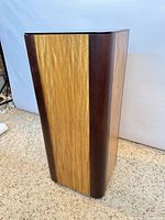 Full view of pedestal showing two-tone wood veneer exterior