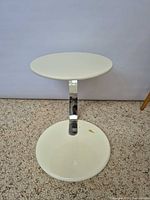 Full view of two-tier white side table