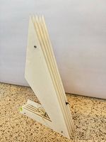 Full view of white acrylic sculptural lamp unlit