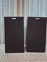 Front view with grilles attached showing Akai badges