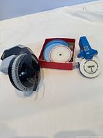 Overall lot showing two embossers, tape spools, spare wheel