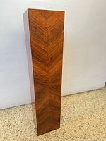 front three-quarter view showing full height and chevron veneer pattern