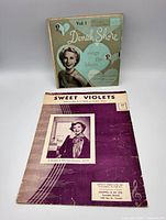 Front view showing record sleeve and sheet music