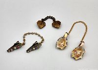 All three sweater clip sets laid out