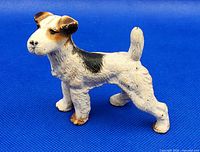 Left side view of painted cast iron Wire Fox Terrier figurine