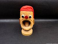 Front view showing comical face, screw mechanism and overall condition