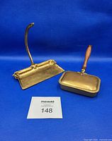 Both brass crumb catchers side by side