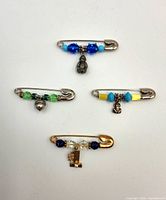 All four beaded friendship pins laid out