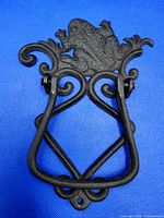 front view showing frog motif and hinge mechanism