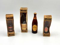 Front view of all four miniature bottles showing packaging and labels