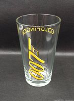 Front view of glass showing 007 gun logo and Goldfinger text