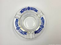 Top view of clear glass ashtray showing Blue Top Brewing graphics and condition