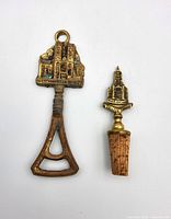 Front view of both brass barware pieces