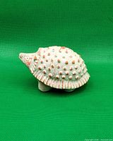 Left side profile of carved stone hedgehog