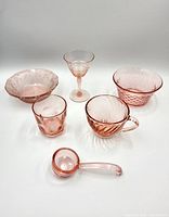 Group shot of all six pink glass items