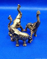 Front view of brass elephant circle figurine