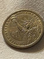 Reverse depicting Statue of Liberty and denomination