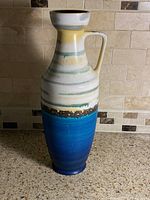 Full front view of vase with handle
